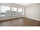 Spacious bedroom with hardwood floors, large windows, and ample natural light at 400 W North St # 814, Raleigh, NC 27603