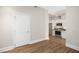 Bright kitchen featuring stainless steel appliances and crisp white cabinetry, seamlessly flowing into an open-concept living area at 400 W North St # 814, Raleigh, NC 27603