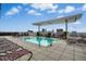 Rooftop pool offering city skyline views with lounge chairs and a shaded area at 400 W North St # 814, Raleigh, NC 27603