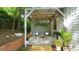 Cozy back patio area with stylish decor, perfect for outdoor relaxation and entertaining at 409 Green St, Sanford, NC 27330