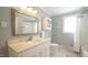 Bathroom with a vanity, sink, and large mirror at 409 Green St, Sanford, NC 27330
