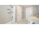 Bathroom with a tiled tub and shower at 409 Green St, Sanford, NC 27330