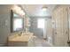 This bathroom features a vanity, sink, mirror, and bathtub at 409 Green St, Sanford, NC 27330