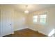 Bedroom with hardwood floors, closet and two bright windows providing natural light at 409 Green St, Sanford, NC 27330