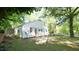 View of the side of the house and backyard featuring a patio and manicured lawn at 409 Green St, Sanford, NC 27330
