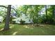 Charming home featuring a classic design, lush landscaping, and a welcoming front yard at 409 Green St, Sanford, NC 27330