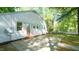 View of the side of the house featuring a patio and access to the backyard at 409 Green St, Sanford, NC 27330