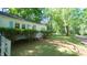 Charming home with a brick walkway and lush lawn at 409 Green St, Sanford, NC 27330