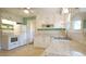 Bright kitchen with white cabinets, stainless steel sink, and granite-style countertops at 409 Green St, Sanford, NC 27330