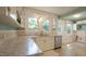 Well-lit kitchen features granite counters, stainless steel dishwasher, and outdoor access at 409 Green St, Sanford, NC 27330
