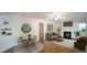 Inviting living room boasts a fireplace, hardwood floors, and ample natural light at 409 Green St, Sanford, NC 27330