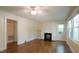 Inviting living room with hardwood floors, a fireplace, and natural light streaming in at 409 Green St, Sanford, NC 27330