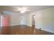 Airy living area features hardwood floors, pink door, and built-in display cabinet at 409 Green St, Sanford, NC 27330