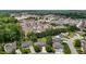 Aerial view of a residential area near commercial buildings showcasing neighborhood's convenient location at 411 Westhampton Dr, Burlington, NC 27215