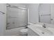 Bathroom featuring a shower with sliding glass doors, toilet, and vanity, maximizing functionality in a compact space at 411 Westhampton Dr, Burlington, NC 27215