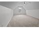 Versatile bonus room featuring high ceilings and a window, ready for personalization with neutral carpet at 411 Westhampton Dr, Burlington, NC 27215