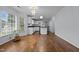 Bright kitchen featuring white cabinets, hardwood floors and natural lighting at 411 Westhampton Dr, Burlington, NC 27215