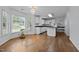 Bright kitchen with white cabinets, hardwood floors and a view of the yard at 411 Westhampton Dr, Burlington, NC 27215