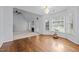 Inviting living room features a fireplace, hardwood floors and many windows at 411 Westhampton Dr, Burlington, NC 27215