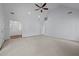 Expansive living room boasts a vaulted ceiling and plush neutral carpeting at 411 Westhampton Dr, Burlington, NC 27215