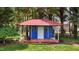 Outdoor shed featuring red roof, painted blue siding, and a concrete base for storage at 411 Westhampton Dr, Burlington, NC 27215