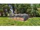 Spacious backyard with an enclosed chicken coop, providing a safe and secure area at 411 Westhampton Dr, Burlington, NC 27215