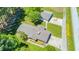 Expansive property featuring a home with a long driveway and a detached garage, all surrounded by lush greenery at 4418 Carpenter Pond Rd, Durham, NC 27703