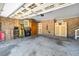 Spacious garage with ample storage, brick walls, and overhead lighting at 4418 Carpenter Pond Rd, Durham, NC 27703