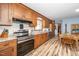 Traditional kitchen with stainless steel appliances, granite countertops, and wood cabinets at 4418 Carpenter Pond Rd, Durham, NC 27703