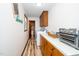 Laundry room with wood cabinets, a utility sink, and a washer and dryer set at 4418 Carpenter Pond Rd, Durham, NC 27703