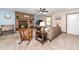Cozy living room featuring a brick fireplace, ceiling fan, and comfortable seating at 4418 Carpenter Pond Rd, Durham, NC 27703
