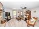 Comfortable living room with fireplace, ceiling fan, and cozy rocking chair at 4418 Carpenter Pond Rd, Durham, NC 27703