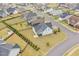 Spacious backyard with well-kept lawn, screened porch and manicured greenery, captured from above in this attractive listing at 47 Scarlet Bell Dr, Youngsville, NC 27596