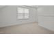 Neutral-toned bedroom with carpet flooring and a window for natural light at 47 Scarlet Bell Dr, Youngsville, NC 27596