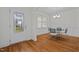 Dining room with hardwood floors, chandelier, and decorative door with elegant glass design at 47 Scarlet Bell Dr, Youngsville, NC 27596