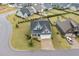 Charming home featuring a well-manicured front yard and an attached two-car garage at 47 Scarlet Bell Dr, Youngsville, NC 27596