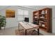 Bright office space with a large window, desk, bookshelf and a comfortable chair at 47 Scarlet Bell Dr, Youngsville, NC 27596