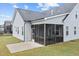 Back of the house with a screened porch and patio, an ideal setting for outdoor entertainment at 47 Scarlet Bell Dr, Youngsville, NC 27596