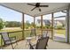 Comfortable screened porch featuring an outdoor seating area, ceiling fan, and neighborhood views at 47 Scarlet Bell Dr, Youngsville, NC 27596