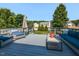 Spacious back deck with comfortable blue patio furniture and a view of the backyard at 4908 Birkenhead Ct, Apex, NC 27539