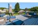 Comfortable back deck area featuring blue patio furniture and an open backyard view at 4908 Birkenhead Ct, Apex, NC 27539
