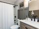 Modern bathroom features sleek black fixtures and a framed mirror above the vanity at 4908 Birkenhead Ct, Apex, NC 27539