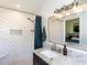Modern bathroom features a tiled shower, granite countertops, and updated fixtures at 4908 Birkenhead Ct, Apex, NC 27539