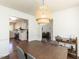 Dining room next to a bright kitchen and inviting living area, with modern lighting at 4908 Birkenhead Ct, Apex, NC 27539
