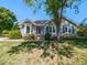 Charming home exterior with a bay window and brick steps leading to the front door at 4908 Birkenhead Ct, Apex, NC 27539