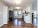 Bright kitchen boasts stainless steel appliances, white cabinets, and hardwood floors at 4908 Birkenhead Ct, Apex, NC 27539