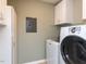 The laundry room includes a washer, dryer, and storage space at 4908 Birkenhead Ct, Apex, NC 27539
