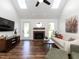 Bright living area with skylights, brick fireplace, and views of the backyard at 4908 Birkenhead Ct, Apex, NC 27539