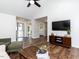 Spacious living room featuring an open layout, wood floors, and access to other rooms at 4908 Birkenhead Ct, Apex, NC 27539