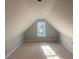 Spacious attic with a dormer window, offering potential for storage or a unique living space at 499 Mulberry Rd, Spring Hope, NC 27882